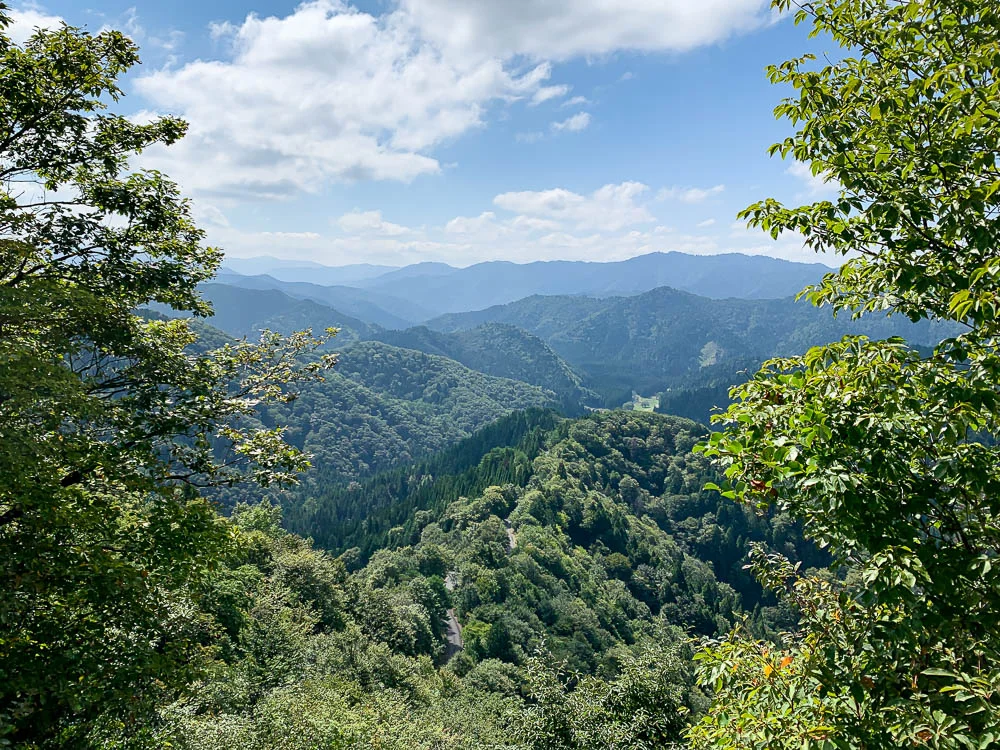 Layered blue-green mountain ridges seen from Onyu Pass